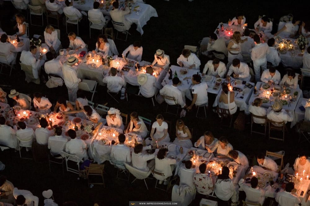 Overhead View of rows of tables and people dressed in white