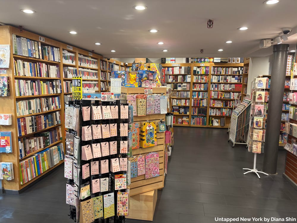 Shelves of books and stickers at Koryo Books