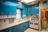 Louis Armstrong Kitchen with blue cabinets