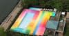 Street Artist HOT TEA Transforms NYC Pool Into Rainbow Color on Roosevelt Island