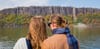 A couple admires the fall foliage at the Palisades