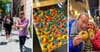 A tray of rainbow bagels and candid photos of people on a bagel tour