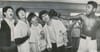 Muhammad Ali playfully pretends to punch The Beatles